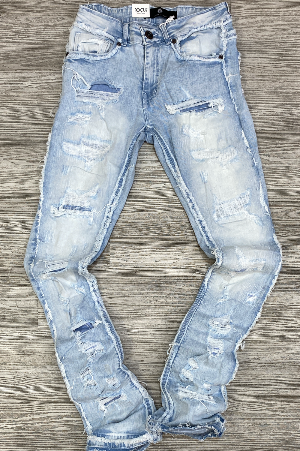 Focus- heavy distressed stacked jeans( ice blue)
