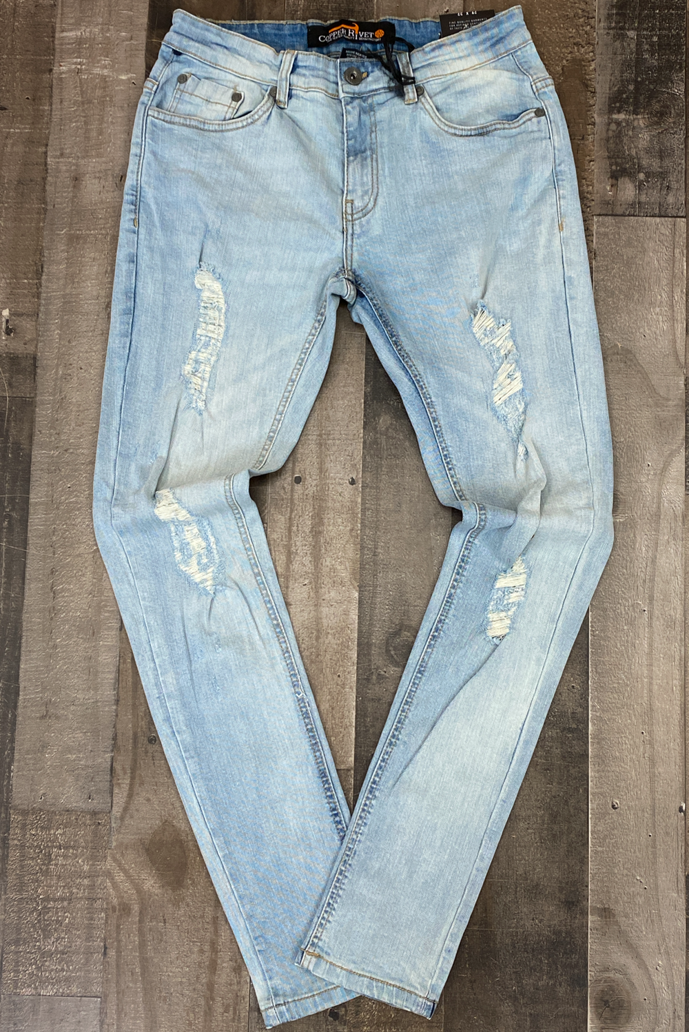 Copper Rivet- light wash jeans w/tinted rips