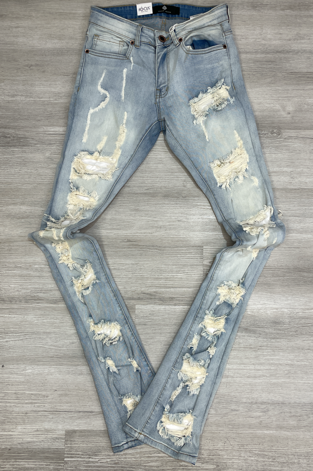 Focus- heavy distressed stacked denim jeans (light vintage)