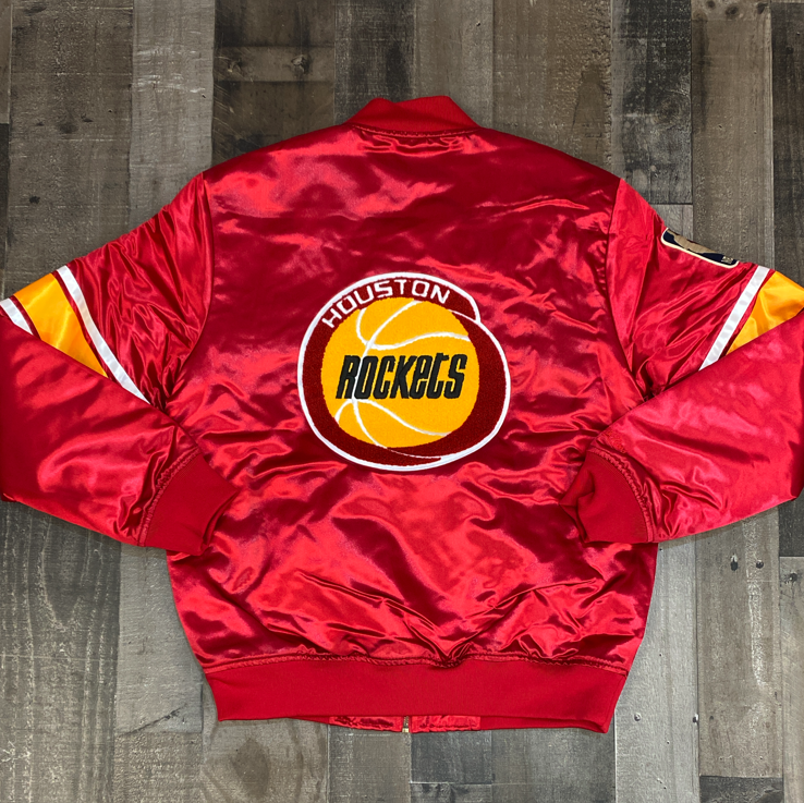 
                  
                    Mitchell & Ness- NBA heavyweight satin jacket Houston Rockets
                  
                
