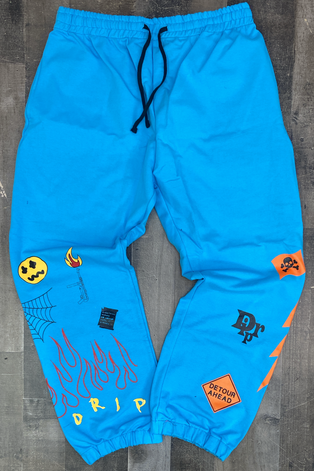 Cooper 9 - “flame on drip” sweatpants pacific blue